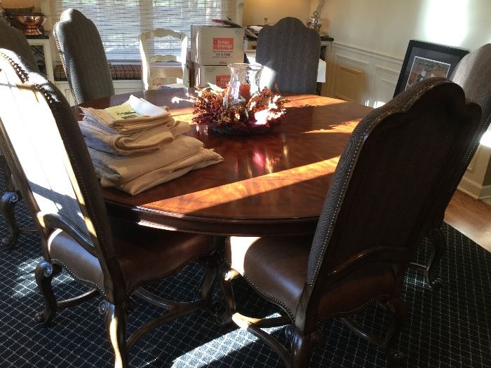 80" round beautiful wood table with leaves and 8 leather/stripped fabric  chairs