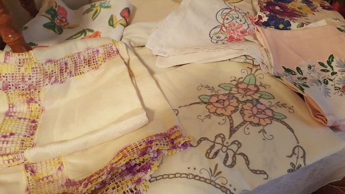 Assorted linens - table cloths, doilies, more