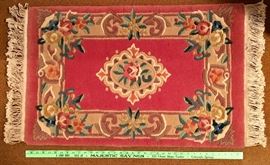 Hand knotted wool area rug