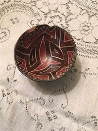 Tiny polychrome pot with dings 