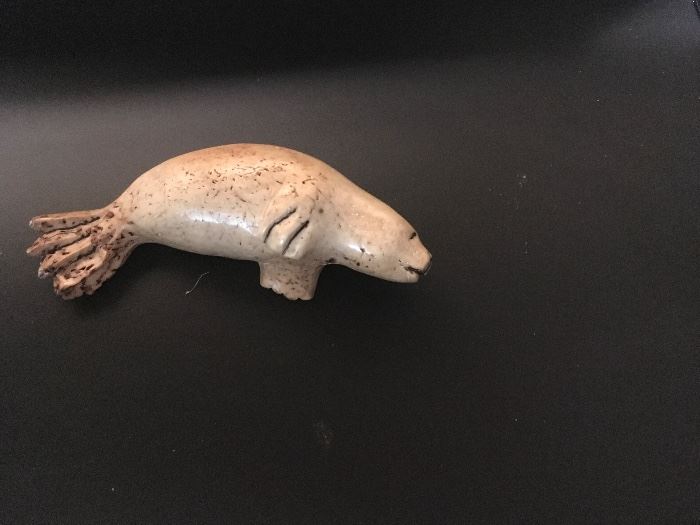 Inuit ossified bone carved seal. 