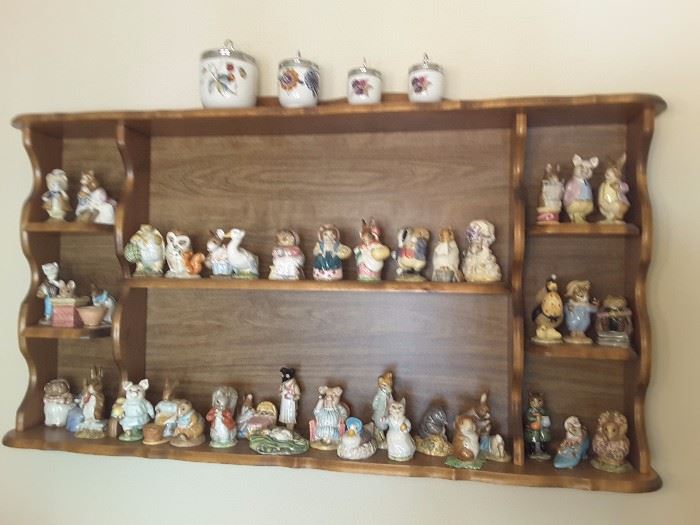 Nook - Wall Unit with 42 Beatrix Potter Ceramics. On top 1 Evesham Jelly Jar, and 3 Egg Evesham Coddlers.