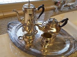 Silver-plated Coffee, Tea, Sugar, Creamer and Tray. Each has their own cloth covers.
