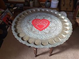 Engraved brass tray with wood stand.