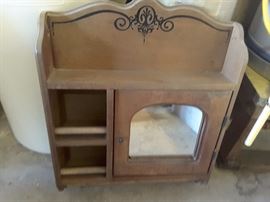 Bathroom wood cabinet, shelves,mirror.