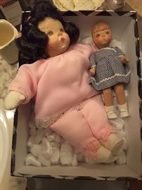 Collectible Dolls, Pink Doll has a Wood Head, Smaller Doll wearing Gingham Dress has a Wood Head. Original Box.