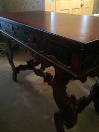 Reddish brown carved sofa/entry table