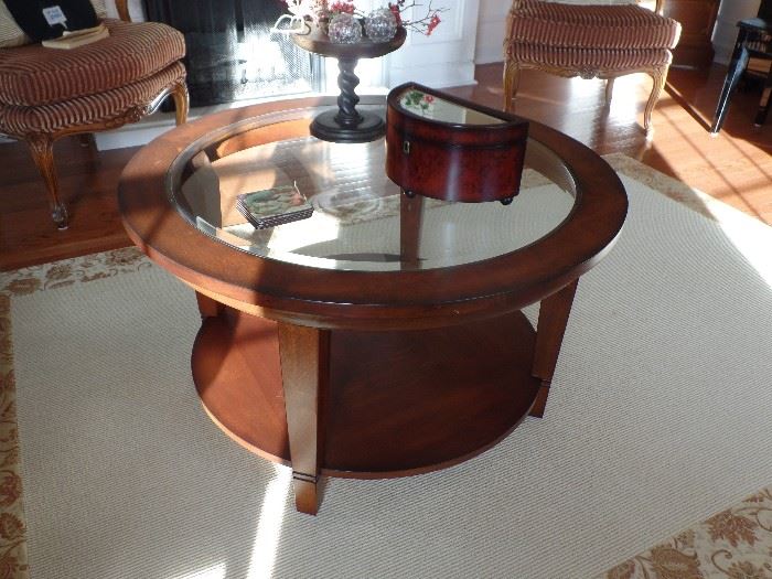 Round, glass and wood coffee table