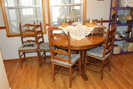 Tell City round table with 6 ladderback chairs and two leaves