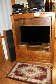Solid oak TV cabinet with 32" Vizio works great.