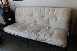 Futon makes into bed and has very clean mattress