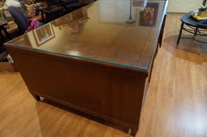 Vintage Partners desk 49" deep, 78" wide and 30 1/2" tall, has 1/4 inch beveled glass top