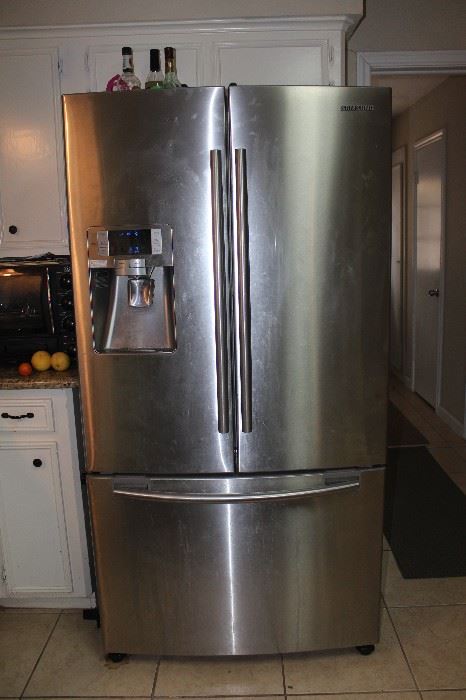 Stainless steel fridge with lower freezer drawer