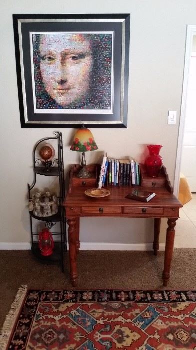 desk,  rugs, many prints, decorative accessories 