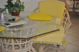 Rattan upholstered dinette with glass top