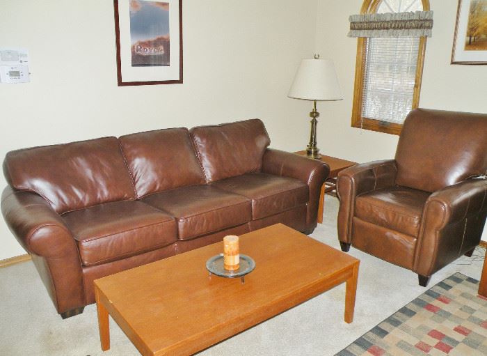 This Flexsteel sofa is less than 2 years old and was purchased at Martin Furniture. $3,500 retail! There are two leather recliners that are older but match well. Nice teak coffee table and teak end table.