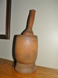 This large mortar and pestle is very old and in great condition.