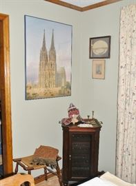Rush seat stool. Wine cabinet. Cathedral print.