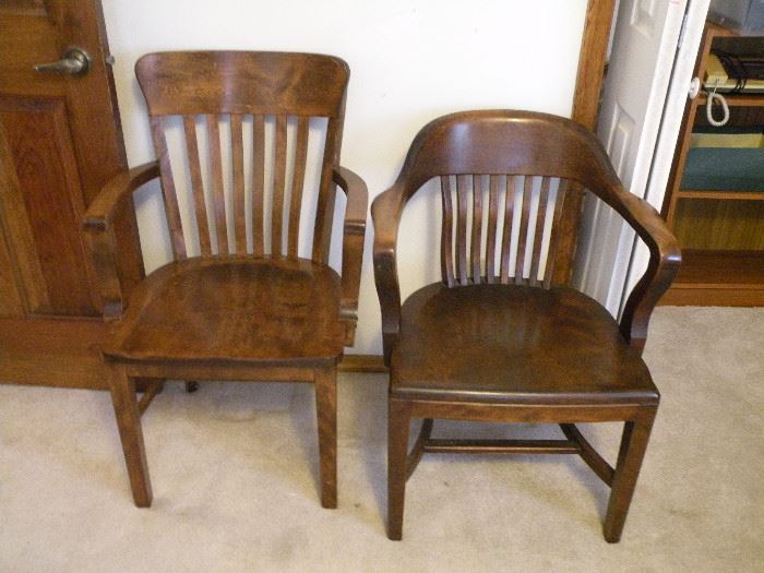 Two vintage solid wood chairs.