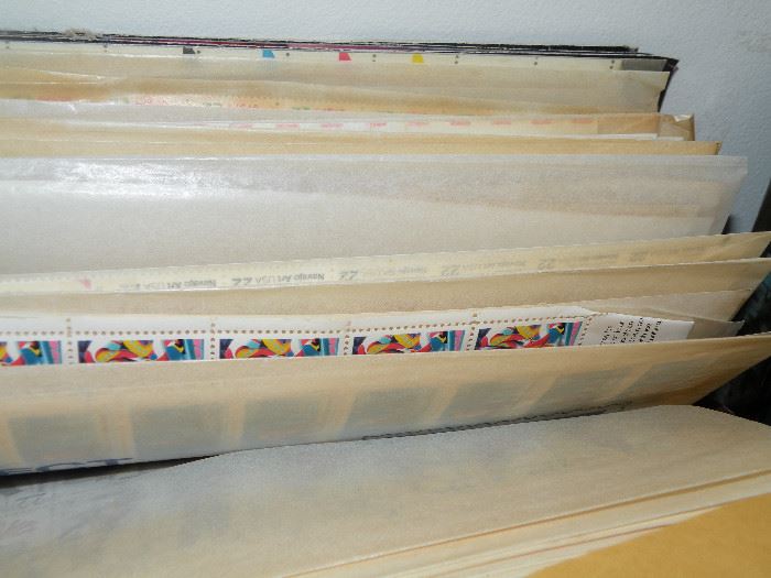 A large file full of vintage stamp sheets. 