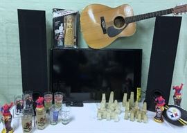 POLK AUDIO SPEAKERS, JADE/ALABASTER CHESS SET, 40" INSIGNIA FLAT SCREEN T.V. YAMAHA ACOUSTIC GUITAR, KENTUCKY DERBY COMMEMORATIVE GLASSES "STEELERS" FOOTBALL, SPIDER MAN SOAPIES