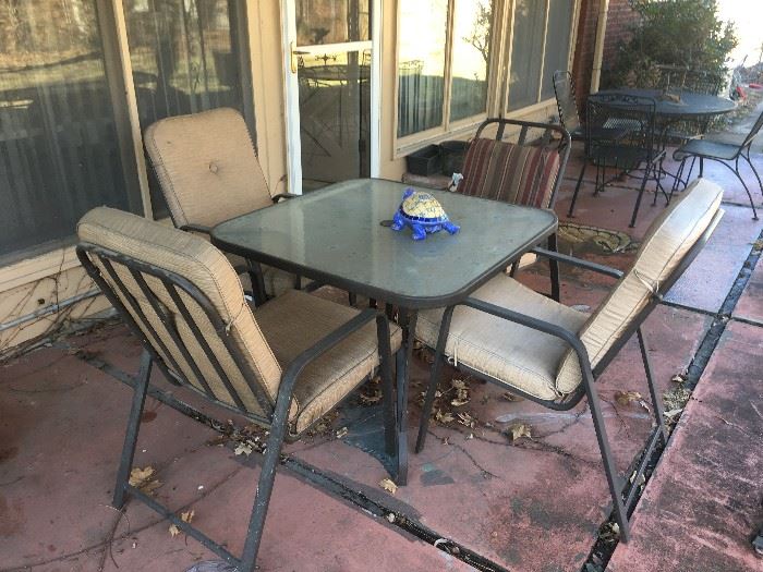 glass top patio table and 4 chairs