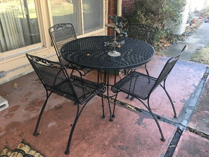 wrought iron pation table and 4 chairs