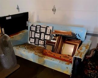 Vintage glider and many picture frames