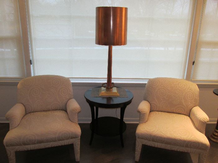 Chairs and firehose nozzle brass lamp.