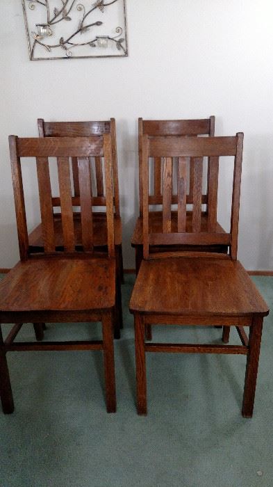 4 oak chairs. One needs some repair