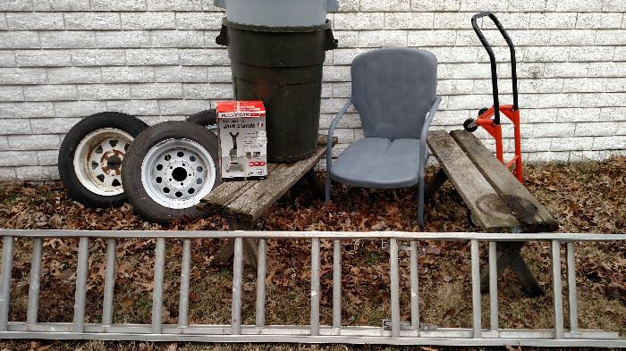 Trailer tires, trash cans no lids, wood benches dolly and vintage chair