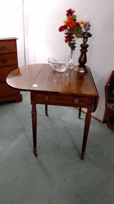 Henredon drop leaf table with drawer on metal wheels