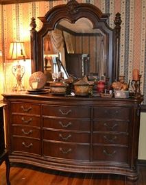 Lot 2: Highly decorative oversized 12 drawer dresser with reeded bun feet and attached beveled mirror; 90"h x 70"w x 20"d, matches lot 9

