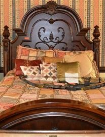 Lot 15: Highly decorative bed (memory foam topper), matches all other bedroom furniture; headboard (80"h); includes bedding and pillows, probably Queen size, approx. 5' in width, matches lot 2, 14, 9
