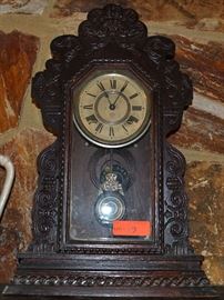 Lot 17: Antique oak Gingerbread mantle clock with key, Ansonia Clock Co.; preview for working condition
