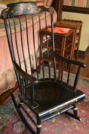 Lot 21: Reproduction Hitchcock style rocking chair made by Nichols and Stone, Massachusetts; 43"h x 24"w x 27"d, painted decoration with stencils
