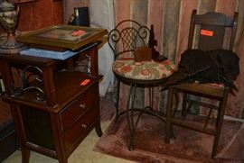 Lot 32: Lot includes two vanity chairs, small two drawer table with lamp and art work
