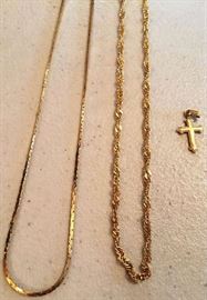 Lot 43: 14k yellow gold necklaces (2) together with 14k gold cross
