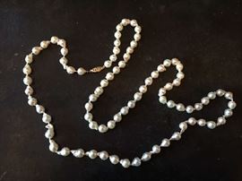 Lot 45: Baroque cultured strand of pearls purchased from Carreras Jewelers, 14k clasp, 34" length, measuring 7.5MM x 8MM, pearls are of fine luster and irregular in shape.
