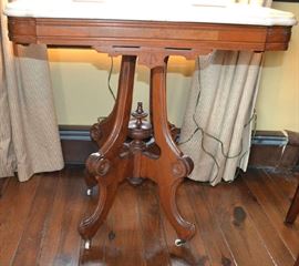 Lot 55: Walnut Eastlake marble top table on casters, 30"h x 30"w x 21"d (38)
