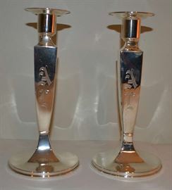 Lot 110: Pair of sterling silver candlesticks, monogrammed "AC", by Lebkuecher & Co #2630/8, 8"h, 1 candlestick has semi-crimped base and denting/tarnishing to side. (13)
