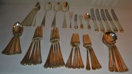 Lot 118: Sterling silver flatware:  "Fairfax" by Gorham with Durgin mark, monogramed "M".  Set consists of 1 youth set (fork/spoon/knife), lemon fork, 5 luncheon knives (8.75"l), 8 ice teaspoons, 3 table spoons, 10 dinner forks, 9 salad forks, 6 soup spoons, 15 teaspoons.  51.00 toz. (excludes knives) 
