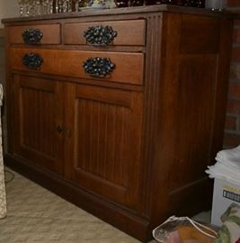 Lot 203: Antique marble top oak server; 36"h x 48"w x 22"d, having 2 drawers over 1 elongated drawer over double door cupboard base
