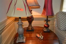 Lot 201: Lot includes three decorative lamps with two decorative finials; tallest lamp is 30"h
