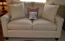 Lot 220: Bassett upholstered love seat and throw pillows; 41"h x 57"w x 36"d (52)
