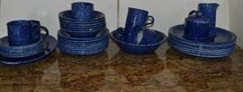 Lot 302: English blue Graniteware lot includes six mugs, six soup bowls, eight salad plates, seven dinner plates, sugar/creamer, small platter, small serving bowl
