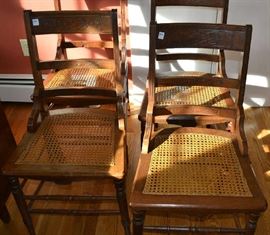 Lot 319: Set of four antique walnut caned seat chairs with embossed splats, caned seats in good condition except for 1 which is stressed (76)
