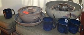 Lot 325: Lot includes four handmade pottery coffee mugs, matching lidded casserole and bowl, sugar/creamer, handled mixing bowl, large decorative bowl
