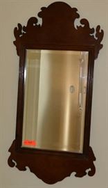 Lot 428: Chippendale style mahogany mirror, 38"h x 16"w, labeled "Bombay Co", beveled glass mirror
