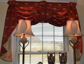 Lot 426: Set of 2 valances in brick red fabric with gold dragonfly accents.  One valance is 96"w; other is 54"w (in DR and LR)
